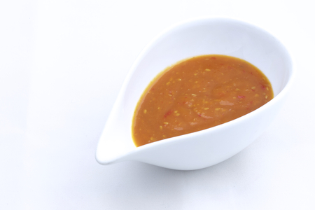 Sukiyaki sauce in cup isolated on white backgroundの写真素材