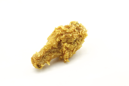 A crispy golden fried chicken leg. Isolated on white.の写真素材
