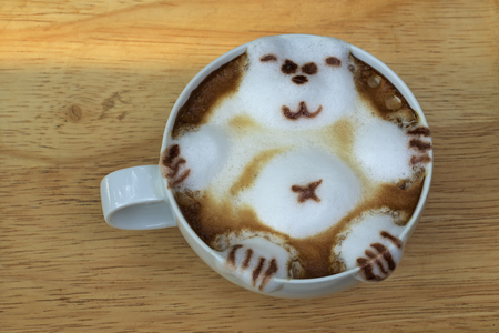 coffee shop latte with decorative bearの写真素材