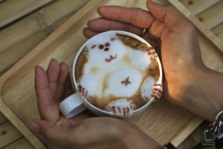 coffee shop latte with decorative bearの写真素材