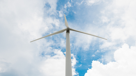 Wind turbine front view on blue sky