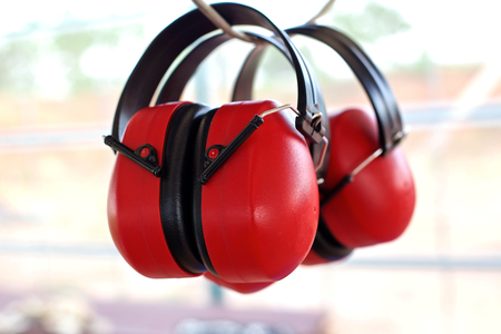 Earmuffs when shooting, hanging on a rope climb in the fire.の写真素材