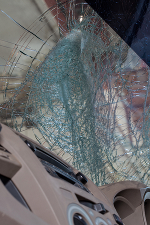 Close Up of a Broken Car Windshield from inside the carの写真素材