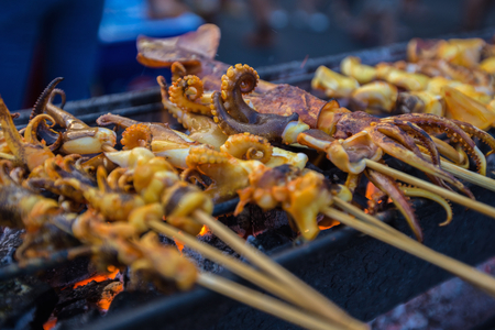Grilled squid ,Thai style street food market.の写真素材
