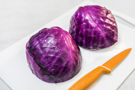 Cut red cabbage isolated on whiteの写真素材