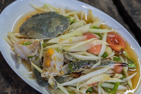 Thai popular dishes, spicy papaya salad with raw blue crabの写真素材
