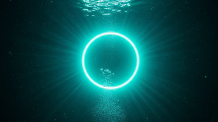 A bright teal neon ring glows underwater, emitting light rays and surrounded by bubbles in the dark water.の素材