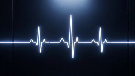 A clear, bright white electrocardiogram waveform stands out against a deep dark blue background, representing a vital sign.の素材