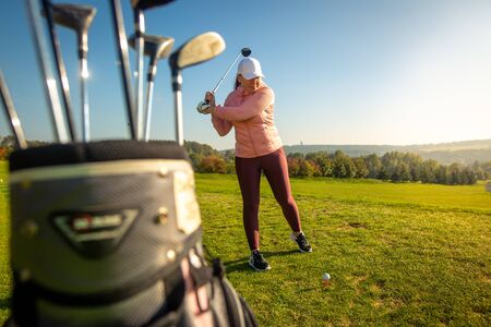 Professional woman golf player ready for competition on the golf, sport conceptの写真素材