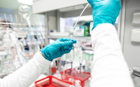 Woman researcher carrying out scientific research in a chemistry lab, drug development