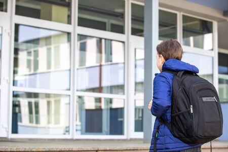 Little boy or school child going to the school, school attendance, education conceptの写真素材