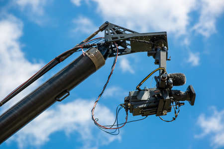 Professional film camera making a video during the big shoot of the series, technology conceptの写真素材