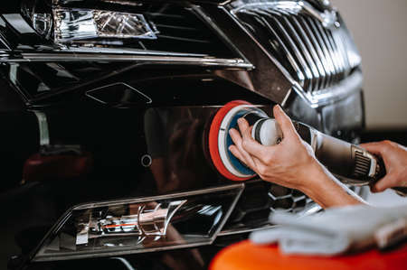 Professional detailing of a modern car, varnish polishing lacquer, cleaning carの写真素材