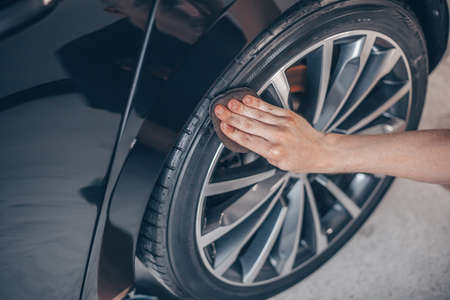 Car detailing concept, cleaning the wheel of the carの写真素材