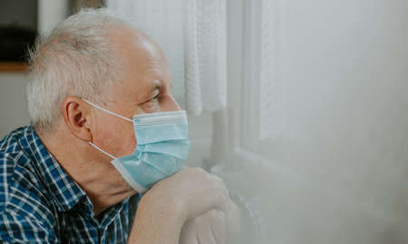 Senior man quarantined at home during coronavirus, covid-2019 pandemic, stay safeの写真素材