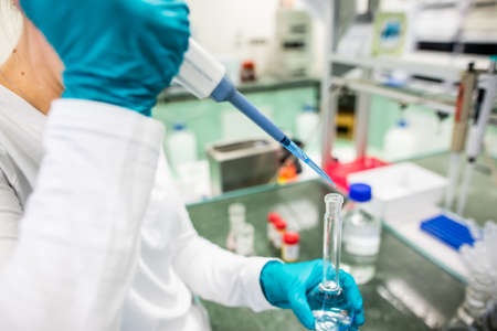 Pharmacist developing a nev vaccine against a kind of viruses, pharmacy concept