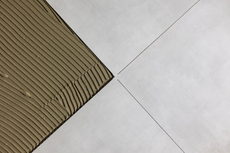 Detail of clips or spacers in the lash tile leveling system, renovation or reconstruction concept