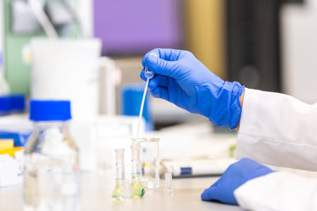 Young woman scientist in a research laboratory creating a scientific experiment, laboratory concept