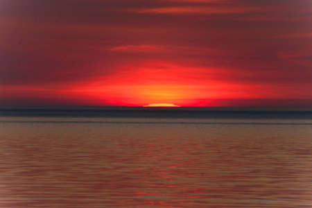 Sunset over Lake Michigan with Red Sunの写真素材