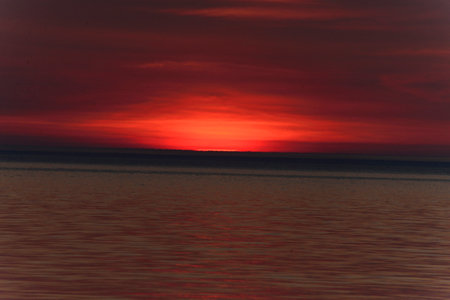 Sunset over Lake Michigan A setting sun over lake michiganの写真素材
