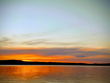 Sunset Over the Water horizon skyの写真素材