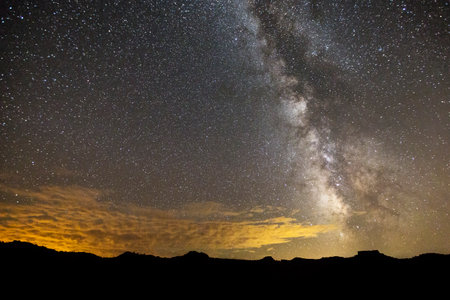 Moonlit Hills and the Milky Way in a Starry Skyの写真素材