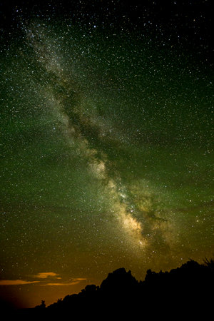 The Milky Way Illuminates the Night Sky Over Harpers Corner Trailhead in Dinosaur National Monumentの写真素材