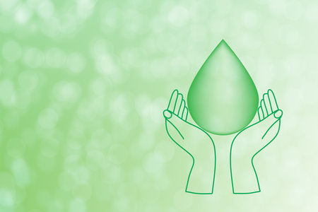 hand holding water drop earth day or international water day concept to saving the globeの写真素材