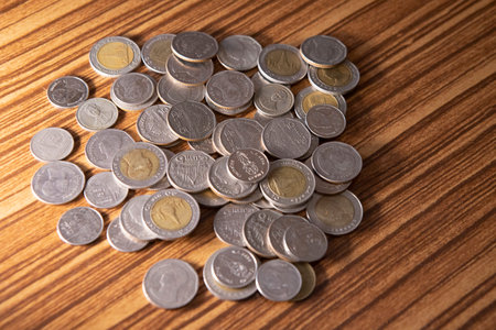Stacking coins on the wooden table and growth graph to save money or investment to get business income by finance  marketingの写真素材