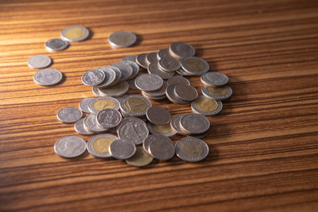 Stacking coins on the wooden table and growth graph to save money or investment to get business income by finance  marketingの写真素材