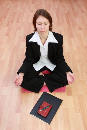 A woman in yoga lotus posture.の写真素材