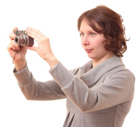 Female photographer takes a small camera.の写真素材
