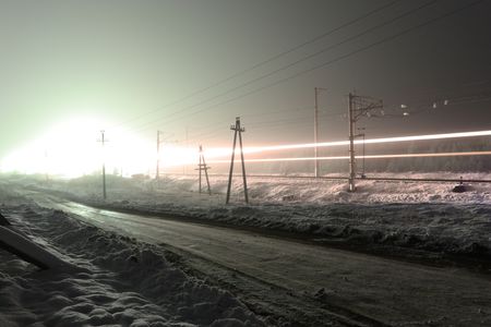 Moving the train on night railway in winter.の写真素材