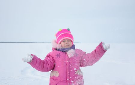 Girl on the nature of a winter day.の写真素材