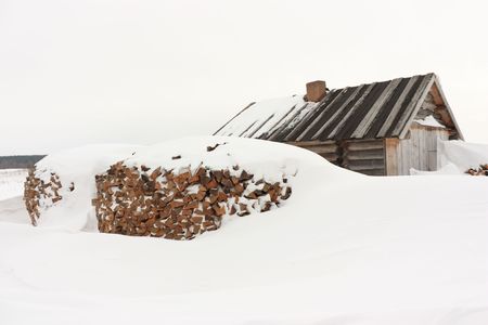 Snow swept home after a heavy snowstorm.の写真素材