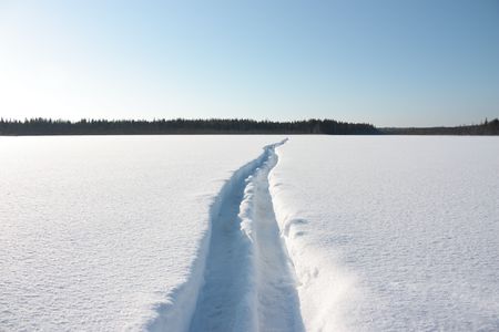 Ski track runs away into the distance.の写真素材