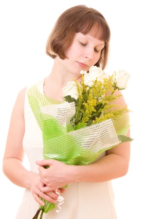 Girl with a bouquet of white roses.の写真素材
