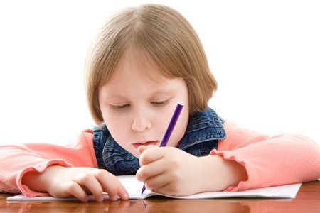 girl wrote on the tableの写真素材