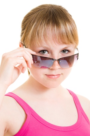 Teen in sunglasses on white background.の写真素材