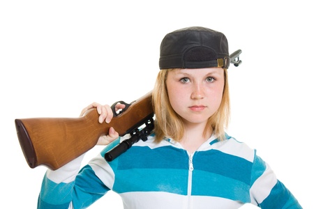 A teenager with a gun on a white background.の写真素材