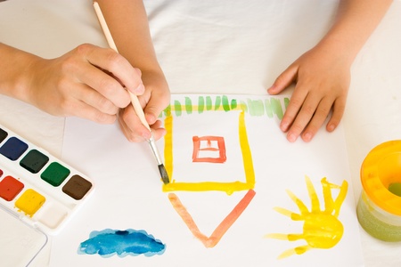 Child with paint on a white background.の写真素材