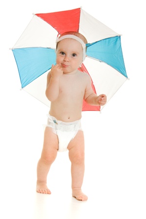 The kid with an umbrella on his head.の写真素材
