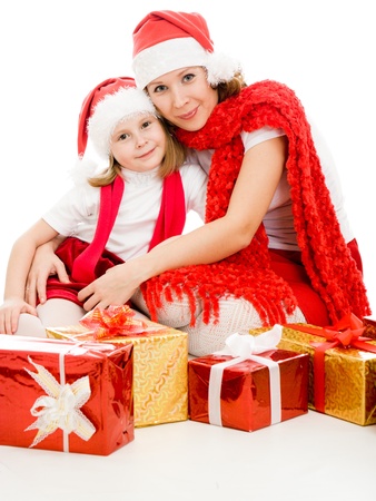 Happy Christmas mother and daughter with presents on a white background.の写真素材