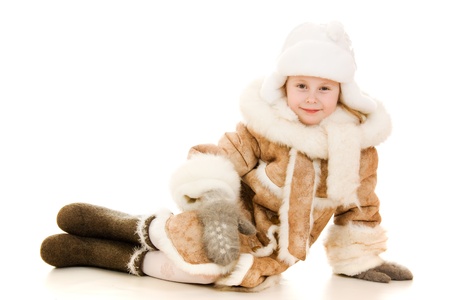 The girl in warm clothes smiling on white background の写真素材
