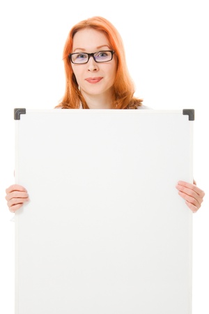 Young businesswoman showing blank signboard, on a white background.の写真素材