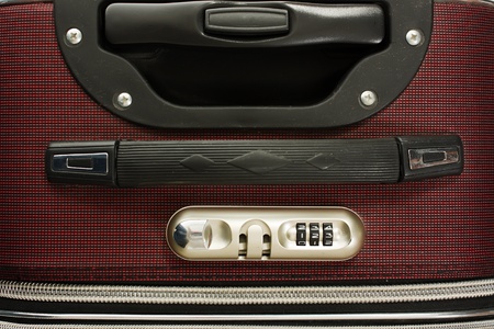 Travel bag with combination lock on white backgroundの写真素材