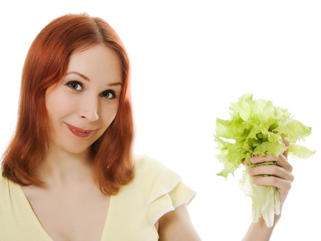 An attractive woman with a salad in his hand on a white background.の写真素材