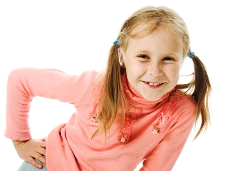 Portrait of emotionally girl. Funny little girl with pigtails isolated on white background.の写真素材