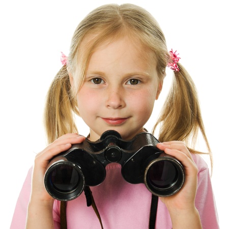 Little girl with binoculars on a white background.の写真素材