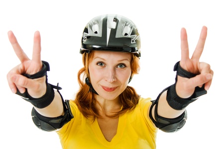beautiful young woman on roller skates on a white background.の写真素材